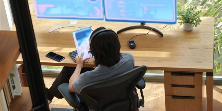 Microsoft unveils Microsoft Security Copilot agents and new protections for AI 1 a person sitting at a desk with a computer